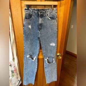 Dark wash distressed jeans. Size 6. Never worn